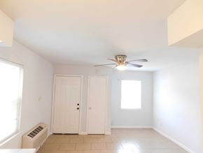 Hammond apartment for rent - A room with a ceiling fan and two doors.
