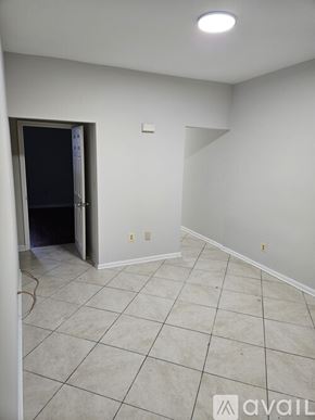 Baltimore townhouse for rent - A room with a doorway leading to another room.