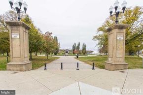 Baltimore townhouse for rent - A park with a walkway and two pillars on either side.