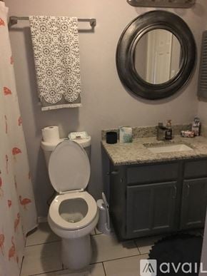 San Antonio apartment for rent - A dining area with a wooden table and blue chairs.