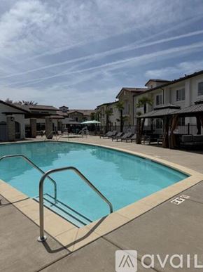 Hanford Ca apartment for rent - A pool with a metal ladder in the middle of it.