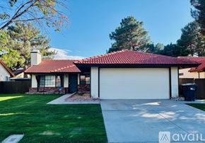 Lancaster house for rent - A house with a red tiled roof and a white garage door.
