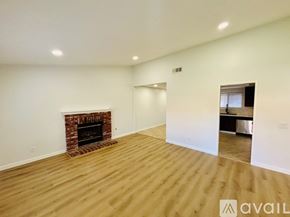 Lancaster house for rent - A room with a fireplace and wooden flooring.