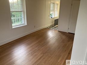 Myersville apartment for rent - A room with wooden flooring and a window.