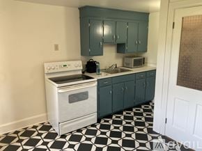 Myersville apartment for rent - A kitchen with a black and white checkered floor.
