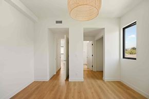 Los Angeles house for rent - A long hallway with a light hanging from the ceiling.