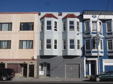 San Francisco apartment for rent - A row of three-story buildings with a car parked in front of them.