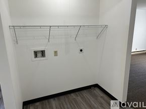 Pekin apartment for rent - Empty room with a shelf and two electrical outlets.