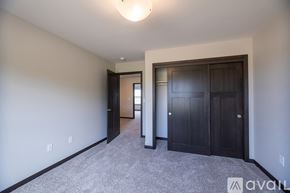 Weston house for rent - A spacious room with a carpeted floor and a ceiling light.