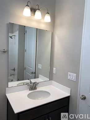 Haines City house for rent - A bathroom sink with a mirror above it.