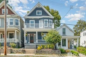 Cincinnati house for rent - A house with a blue front door and white railings.