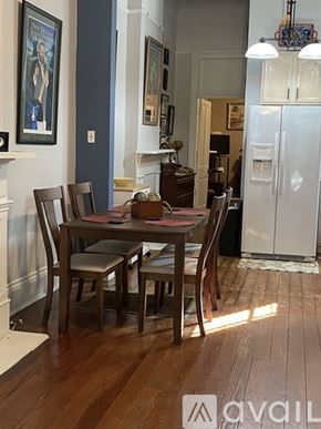 New Orleans house for rent - A dining room with a table set for four.