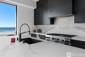 Manhattan Beach condo for rent - A modern kitchen with a stove top oven and a sink.