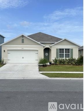 Davenport house for rent - A two-car garage is attached to a house.