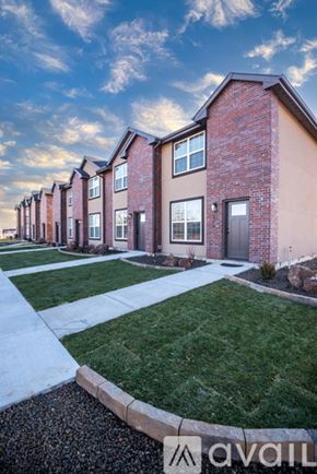 Fruitland apartment for rent - A row of houses with the logo "avail" on the bottom right.