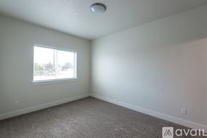 Payette apartment for rent - A room with a carpeted floor and a window letting in light.