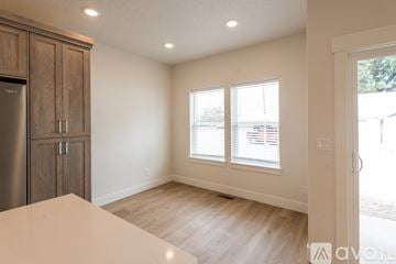Payette apartment for rent - A kitchen with wooden cabinets and a refrigerator.