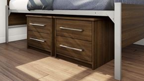 London apartment for rent - A bed with a white headboard and a wooden dresser underneath it.