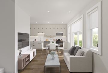 London apartment for rent - A modern living room with a grey couch and a wooden floor.