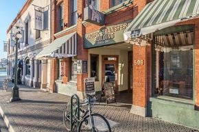 Victoria apartment for rent - A bicycle is parked in front of a building with a sign that says "Pacific Transfer Building".