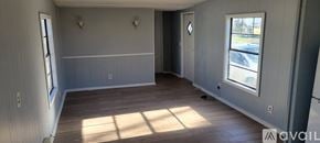 Dublin apartment for rent - A room with wooden floors and grey walls.