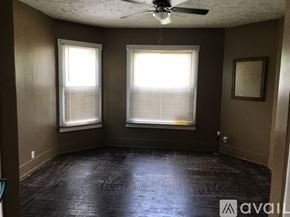 Warren house for rent - A room with a ceiling fan and two windows.