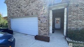 Dallas house for rent - A house with a garage door and a sign that says "3710" on the wall.