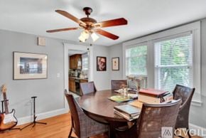 Newton apartment for rent - A dining room with a wooden table and chairs.