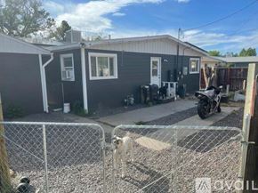 Grand Junction townhouse for rent - A room with a fan and a rug on the floor.