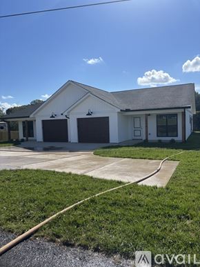 Mount Airy house for rent - A white house with a grey roof and a grey garage door.