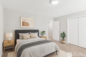 Nashville apartment for rent - A bedroom with a large bed and a painting on the wall.