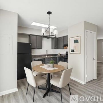 Nashville apartment for rent - A modern kitchen with a dining table set for two.