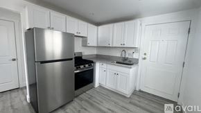 Sparks apartment for rent - A room with wooden flooring and white walls.
