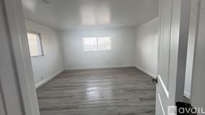 Sparks apartment for rent - A room with wooden flooring and white walls.