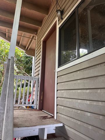 Waikoloa Village apartment for rent - A white door is open to a porch.