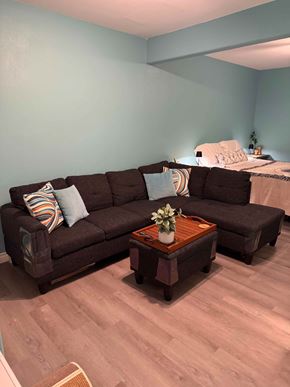 Kailua-Kona apartment for rent - A brown sofa with a wooden coffee table in front of it.