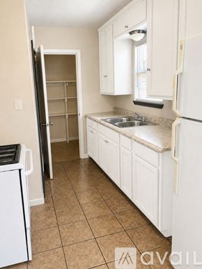 Corpus Christi apartment for rent - A room with a ceiling fan and a window with blinds.