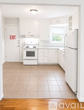 Corpus Christi apartment for rent - A room with a ceiling fan and a window with blinds.