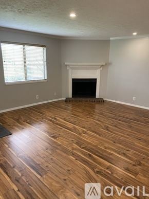 Nashville condo for rent - A room with wooden flooring and a fireplace.