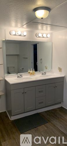 Calais apartment for rent - A bathroom with a vanity and a mirror.
