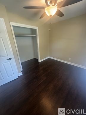 Holland house for rent - A room with a ceiling fan and wooden floors.