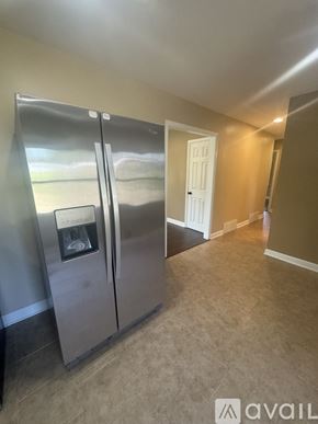 Holland house for rent - A stainless steel refrigerator with a water dispenser in the middle of the door.
