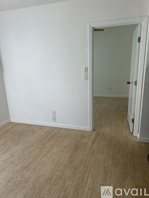 Long Beach apartment for rent - A room with a white door and a light switch on the wall.