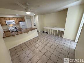 Boulder condo for rent - A kitchen with a refrigerator, microwave, and oven.