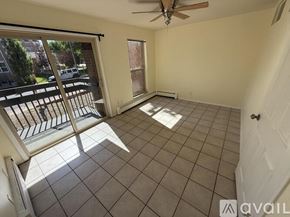 Boulder condo for rent - A room with a ceiling fan and tiled flooring.