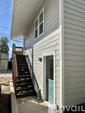 Denver house for rent - A house with a staircase leading to the front door.