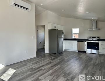 Denver house for rent - A kitchen with a refrigerator, stove, and oven.