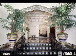 San Francisco condo for rent - A staircase with a black railing and a tiled floor.