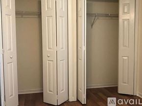 Myrtle Beach house for rent - A room with three white closet doors.