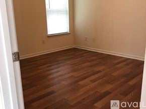 Myrtle Beach house for rent - A room with wooden flooring and a window.